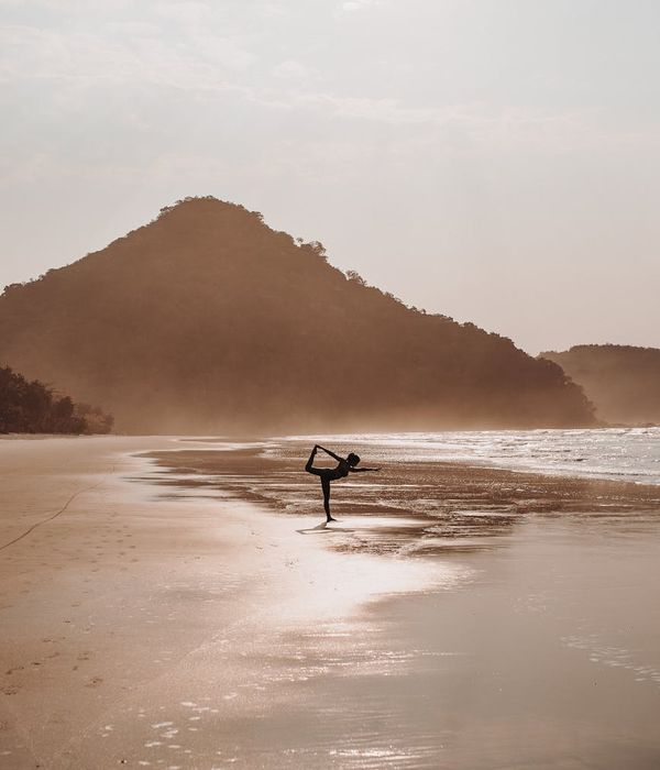 Woman in a calm yoga pose, embodying balance and focus.